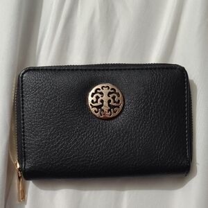 Gold and Black Pebbled Wallet with Circular Emblem